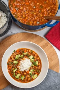 Chorizo bean chipotle stew garnish with diced avocado.